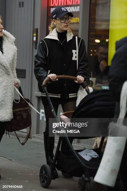 Roxy Horner is seen taking a stroll with her baby daughter on March 12, 2024 in London, United Kingdom.