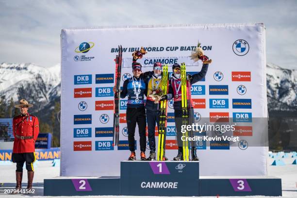 Second placed Tommaso Giacomel of Italy, first placed Johannes Thingnes Boe of Norway and third placed Tarjei Boe of Norway celebrates during the...