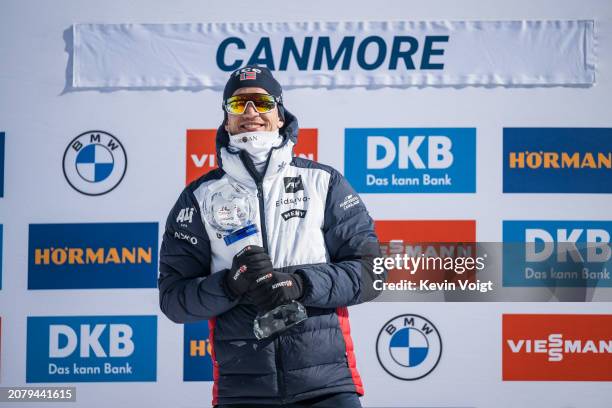 Tarjei Boe of Norway with the trophy during the award ceremony for the sprint world cup score after the Men 10 km Sprint at the BMW IBU World Cup...