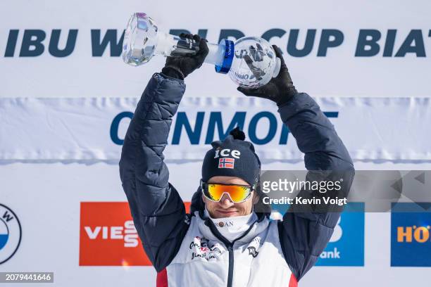 Tarjei Boe of Norway with the trophy during the award ceremony for the sprint world cup score after the Men 10 km Sprint at the BMW IBU World Cup...