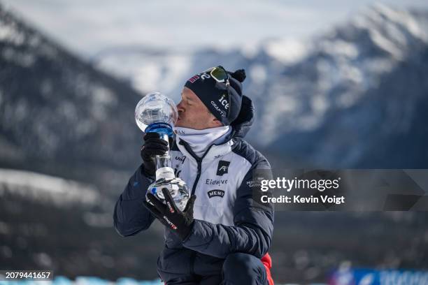 Tarjei Boe of Norway with the trophy for the sprint world cup score after the Men 10 km Sprint at the BMW IBU World Cup Biathlon on March 15, 2024 in...