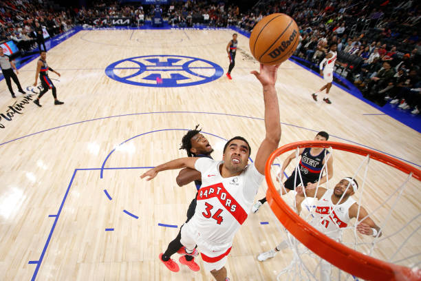 Jontay Porter of the Toronto Raptors grabs a rebound during the game against the Detroit Pistons on March 13, 2024 at Little Caesars Arena in...