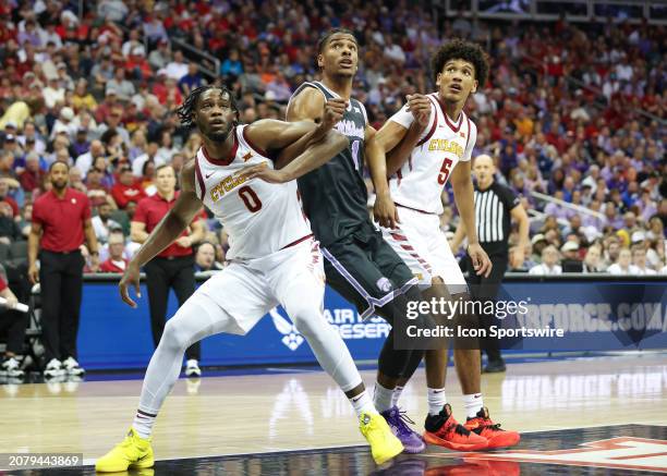 Kansas State Wildcats forward David N'Guessan tries to fight through the block out of Iowa State Cyclones forward Tre King and guard Curtis Jones in...