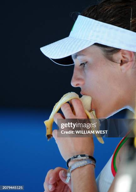 Andrea Petkovic of Germany eats a banana during a break in her women's singles quarter-final match against Li Na of China on the nineth day of the...