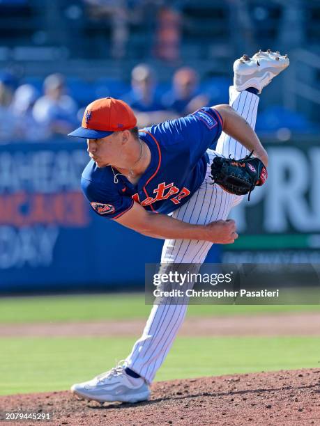 Calvin Ziegler of the New York Mets throws a pitch during the top of the seventh inning of a spring training game against the Washington Nationals at...