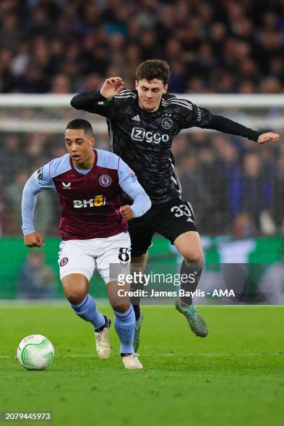 Youri Tielemans of Aston Villa and Benjamin Tahirovic of AFC Ajax during the UEFA Europa Conference League 2023/24 round of 16 second leg match...