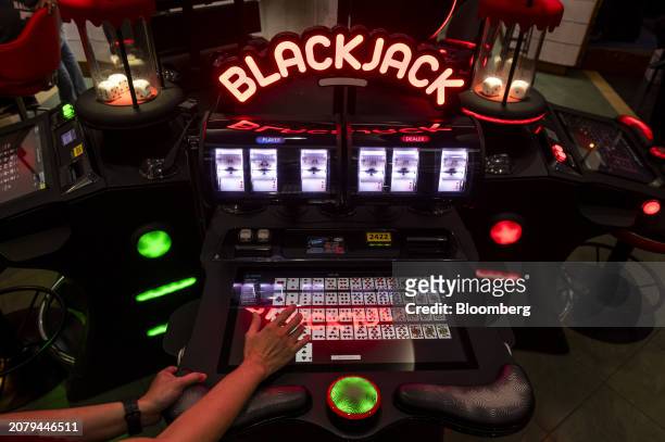 An electronic Blackjack machine inside Philippine Amusement and Gaming Corp.'s Casino Filipino Citystate, in Manila, the Philippines, on Thursday,...