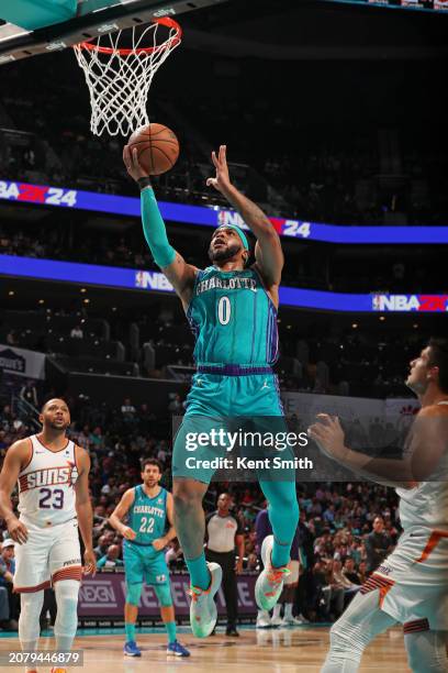 Miles Bridges of the Charlotte Hornets drives to the basket during the game against the Phoenix Suns on March 15, 2024 at Spectrum Center in...