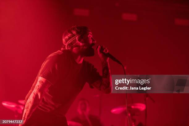 Joe Talbot of British band Idles performs live on stage during a concert at Max-Schmeling-Halle on March 15, 2024 in Berlin, Germany.