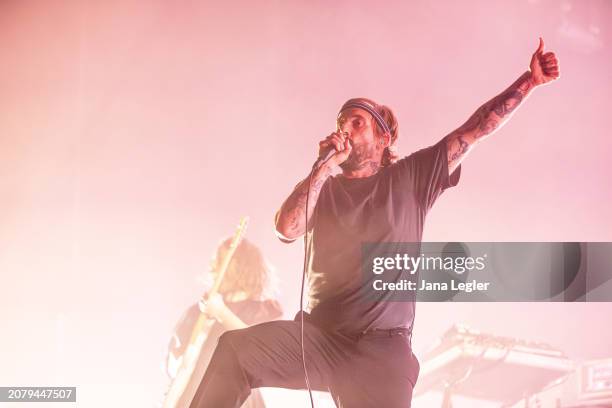 Joe Talbot of British band Idles performs live on stage during a concert at Max-Schmeling-Halle on March 15, 2024 in Berlin, Germany.