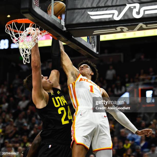 Jalen Johnson of the Atlanta Hawks shoots over Walker Kessler of the Utah Jazz during the first half of a game at Delta Center on March 15, 2024 in...