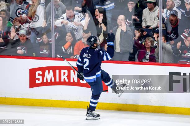 Dylan DeMelo of the Winnipeg Jets celebrates after scoring a third period goal against the Anaheim Ducks at the Canada Life Centre on March 15, 2024...