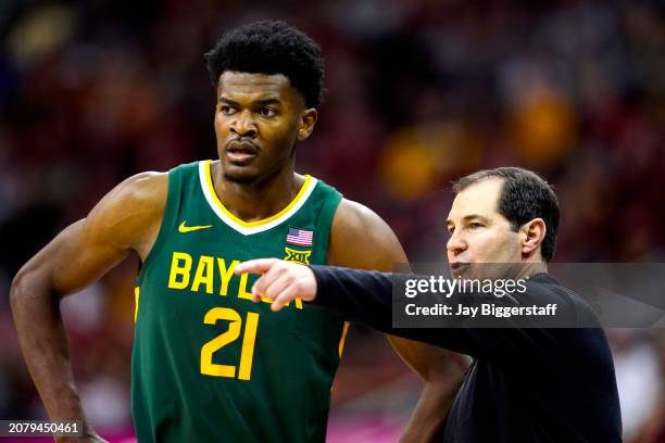 Head coach Scott Drew of the Baylor Bears talks with Yves Missi during the second half of a semifinal game of the Big 12 Men's Basketball Tournament...