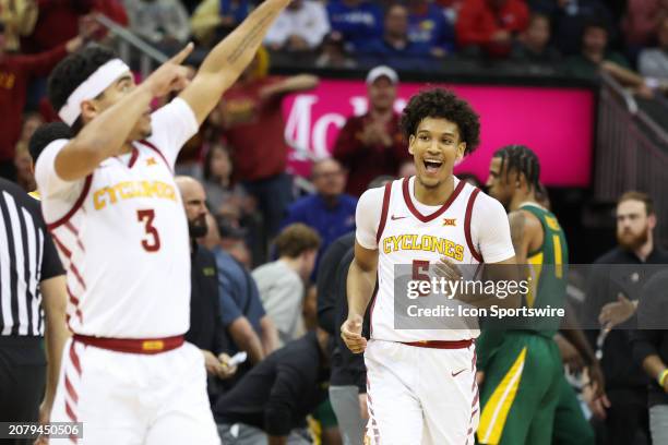 Iowa State Cyclones guard Curtis Jones smiles as guard Tamin Lipsey celebrates after taking a big lead in the second half of a Big 12 tournament...