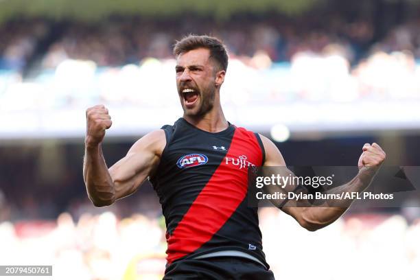 Kyle Langford of the Bombers celebrates a goal during the 2024 AFL Round 01 match between the Essendon Bombers and the Hawthorn Hawks at the...