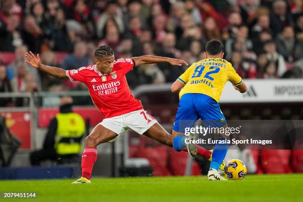 David Neres of Benfica fights for the ball with Mateus Fernandes of Estoril during the Liga Portugal Betclic match between SL Benfica and GD Estoril...