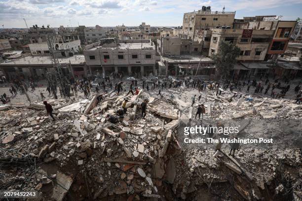 Palestinians inspect their homes after Israeli strikes hit the Al-Masry Tower on Saturday, Mar. 9, 2024 in Rafah, southern Gaza Strip. The 14-story...