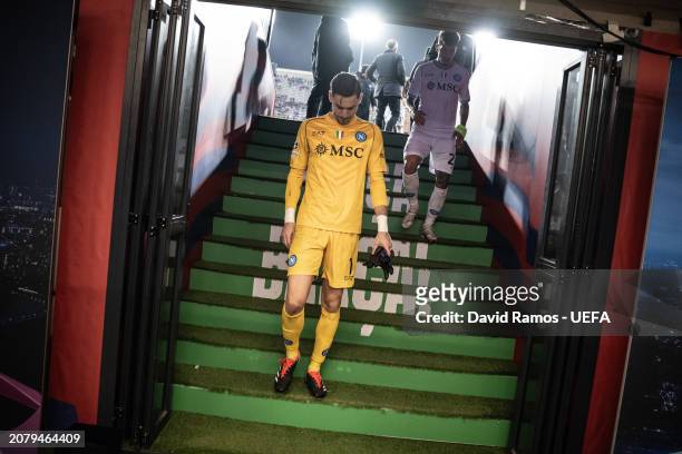 Alex Meret of SSC Napoli walks towards the dressing room after their defeat during the UEFA Champions League 2023/24 round of 16 second leg match...