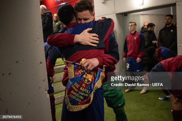 Marc-André ter Stegen of FC Barcelona hugs his team mate Joao Cancelo in the tunnel prior to the UEFA Champions League 2023/24 round of 16 second leg...