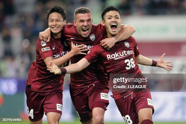 Daiju Sasaki of Vissel Kobe celebrates with teammates Lukas Podolski and So Fujitani after scoring the team's second goal during the J.League J1...