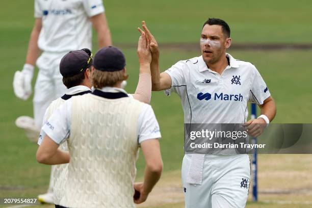 Scott Boland of Victoria celebrates the wicket of Cameron Bancroft of Western Australia during the Sheffield Shield match between Victoria and...