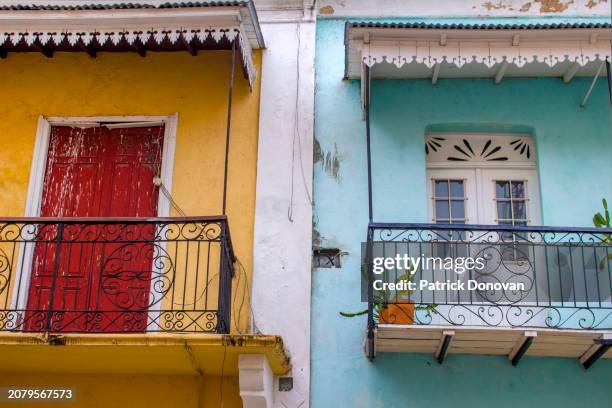 colorful facades with decorative balconies, santo domingo, dominican republic - spanish-colonial-architecture stock pictures, royalty-free photos & images