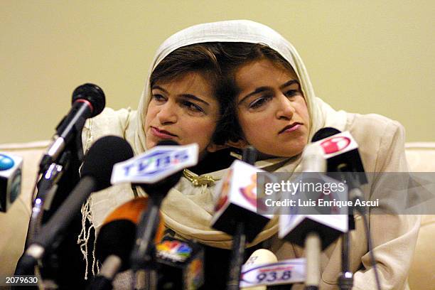 Conjoined twins Ladan and Laleh Bijani speak during a news conference at Raffles Hospital June 11, 2003 in Singapore. The Iranian sisters arrived in...