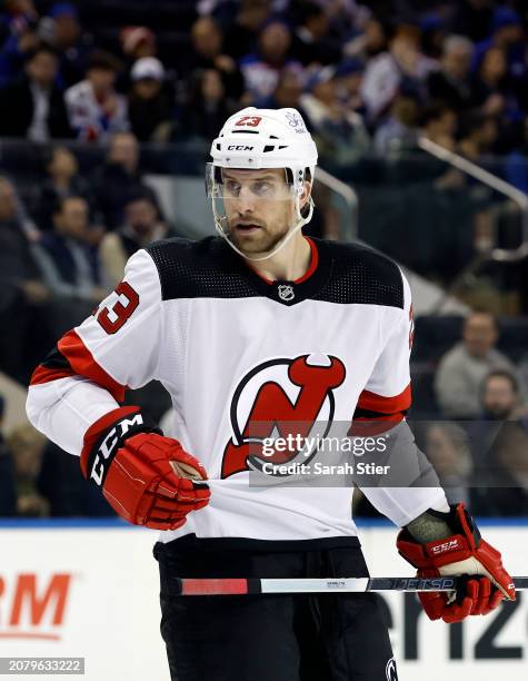 Kurtis MacDermind of the New Jersey Devils looks on during the second period against the New York Rangers at Madison Square Garden on March 11, 2024...