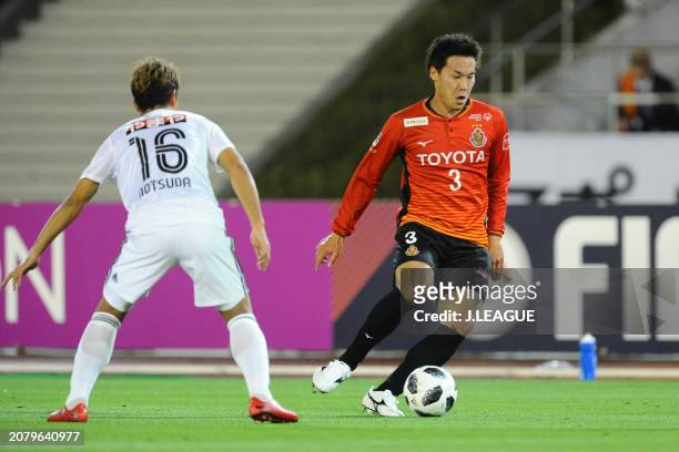 Kazuki Kushibiki of Nagoya Grampus controls the ball against Gakuto Notsuda of Vegalta Sendai during the J.League J1 match between Nagoya Grampus and...