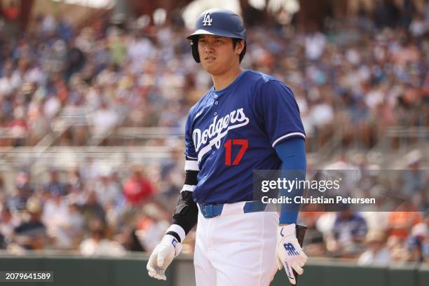 Shohei Ohtani of the Los Angeles Dodgers bats against the San Francisco Giants during the fifth inning of the MLB spring game at Camelback Ranch on...