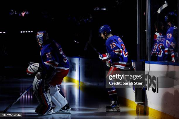 Jonathan Quick, Jimmy Vesey, and Alexis Lafreniere of the New York Rangers take the ice during the first period against the New Jersey Devils at...