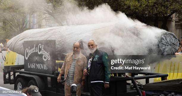 Cheech Marin and Tommy Chong attend the Premiere of "Cheech and Chong's Last Movie" with a large marijuana joint at The Paramount Theatre during the...