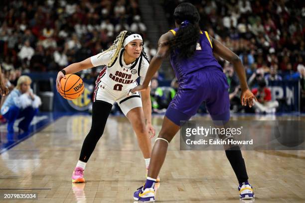 Te-Hina Paopao of the South Carolina Gamecocks dribbles against Flau'jae Johnson of the LSU Lady Tigers in the third quarter during the championship...