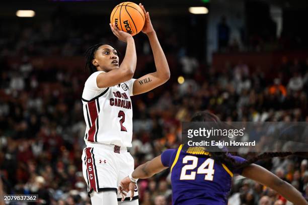 Ashlyn Watkins of the South Carolina Gamecocks shoots over Aneesah Morrow of the LSU Lady Tigers in the fourth quarter during the championship game...