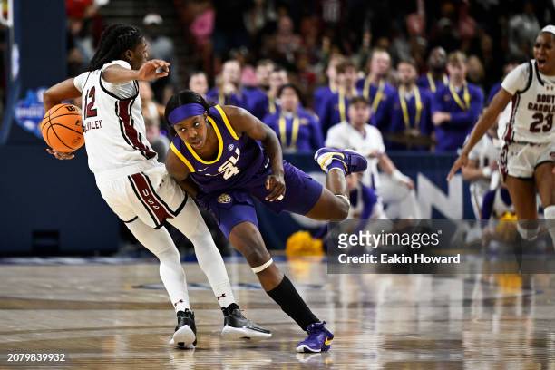 Flau'jae Johnson of the LSU Lady Tigers fouls MiLaysia Fulwiley of the South Carolina Gamecocks in the fourth quarter during the championship game of...