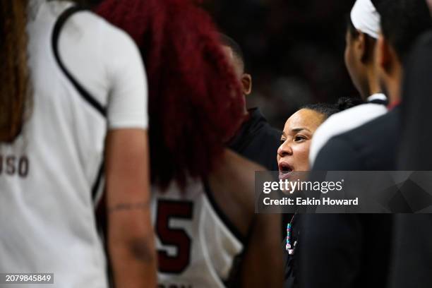 Head coach Dawn Staley of the South Carolina Gamecocks speaks with her team after an altercation broke out on the court against the LSU Lady Tigers...