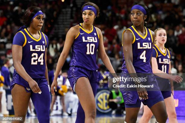 Aneesah Morrow, Angel Reese, Flau'jae Johnson, and Hailey Van Lith of the LSU Lady Tigers stand on the court against the South Carolina Gamecocks in...