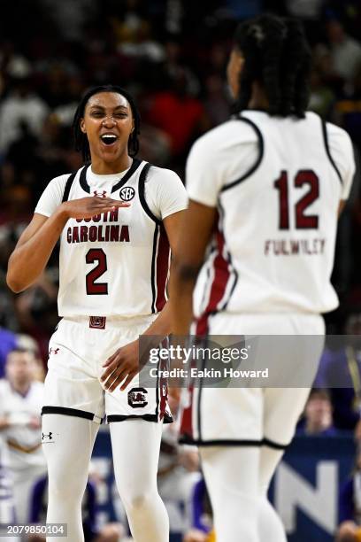 Ashlyn Watkins and MiLaysia Fulwiley of the South Carolina Gamecocks celebrate a basket against the LSU Lady Tigers in the fourth quarter during the...