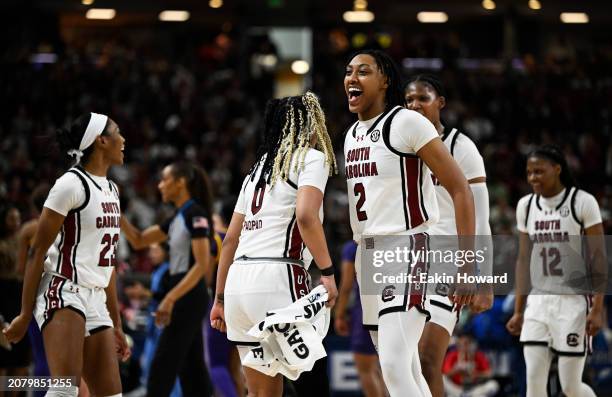 Ashlyn Watkins, Te-Hina Paopao, Bree Hall, MiLaysia Fulwiley, and Sania Feagin of the South Carolina Gamecocks celebrate against the LSU Lady Tigers...