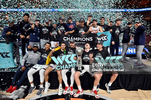 The Saint Mary's Gaels celebrate with the championship trophy after the team defeated the Gonzaga Bulldogs in championship game of the West Coast...