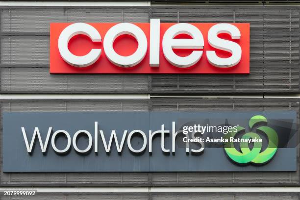 Woolworths and Coles supermarket signage on March 13, 2024 in Melbourne, Australia. Australia's two major supermarket chains, Coles and Woolworths,...