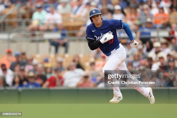 Shohei Ohtani of the Los Angeles Dodgers runs the bases during the first inning of the MLB spring game against the San Francisco Giants at Camelback...