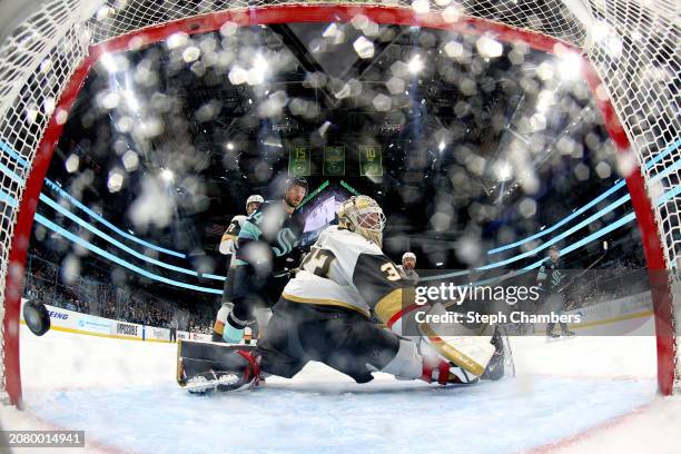 Adin Hill of the Vegas Golden Knights gives up a goal to Andre Burakovsky of the Seattle Kraken during the second period at Climate Pledge Arena on...