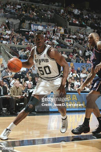 David Robinson of the San Antonio Spurs drives to the basket during Game two of the 2003 NBA Finals against the New Jersey Nets at the SBC Center in...
