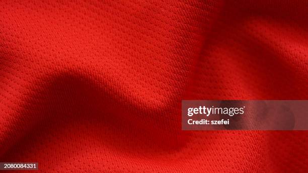 full frame shot of red colored jersey fabric, close up - jersey fabric stock pictures, royalty-free photos & images