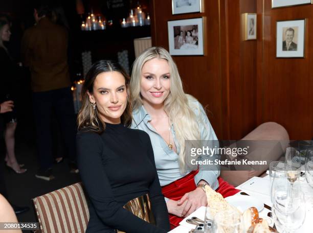 Alessandra Ambrosio and Lindsey Vonn attend the Roger Federer and Oliver Peoples collaboration launch dinner on March 12, 2024 in Los Angeles,...