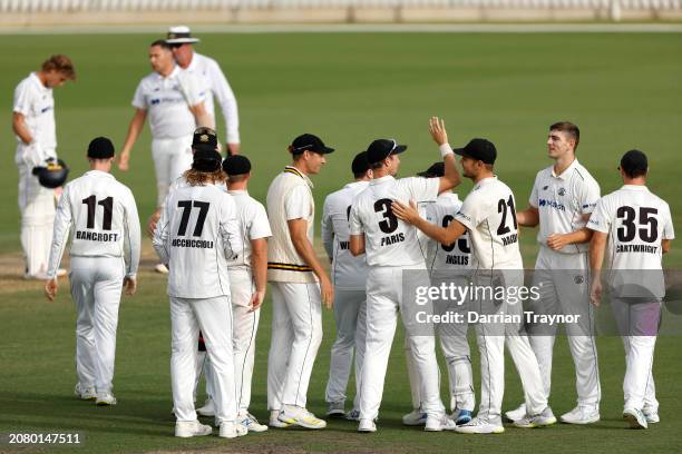 Western Australian players celebrates their win after the final wicket falls during the Sheffield Shield match between Victoria and Western Australia...