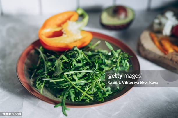 vegetable salad cherry tomatoes, baked pepper, salad mix and onion with grilled haloumi (halloumi) cheese. keto diet, healthy food. light grey stone background. top view. - rucola foto e immagini stock