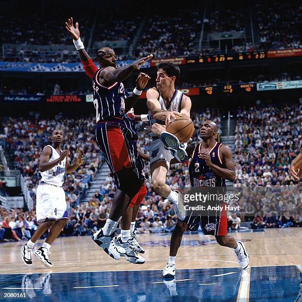 John Stockton of the Utah Jazz goes in for a layup during a 1997 NBA game against the Houston Rockets at the Delta Center in Salt Lake City, Utah....