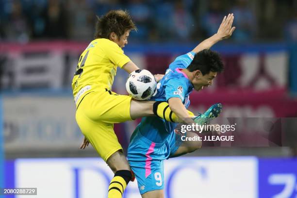 Junya Ito of Kashiwa Reysol and Cho Dong-geon of Sagan Tosu compete for the ball during the J.League J1 match between Sagan Tosu and Kashiwa Reysol...